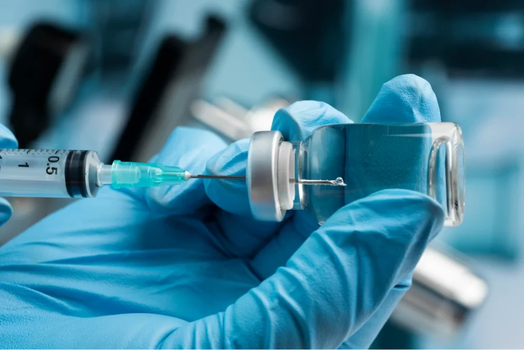 covid still life with vaccine